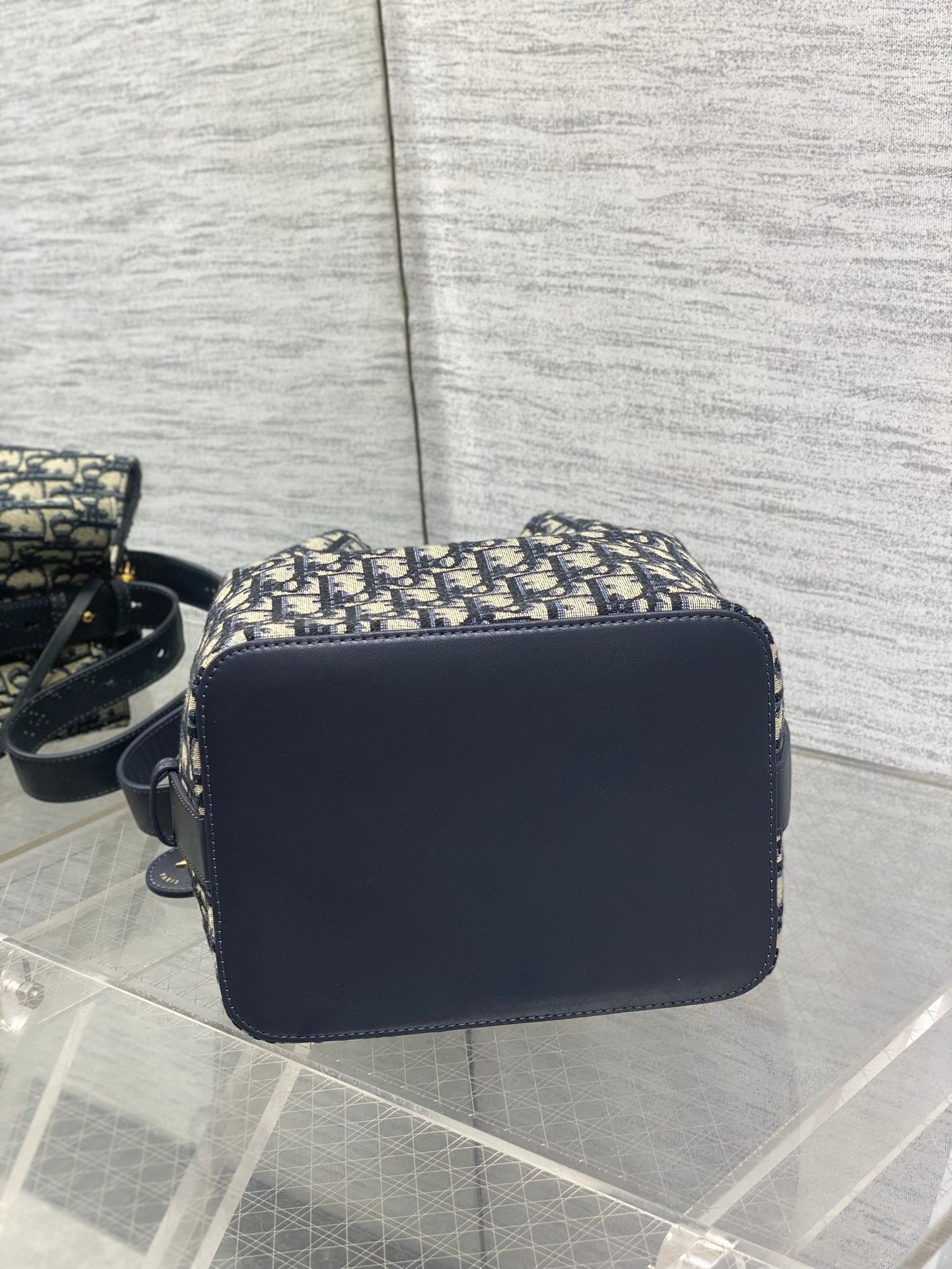 Navy flap crossbody bag with smooth leather finish and gold-tone hardware
