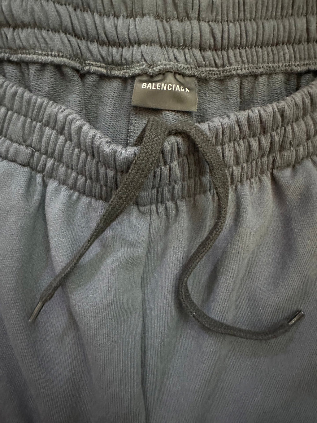Balenciaga elastic waistband with drawstring and interior pocket opening on dark blue pants