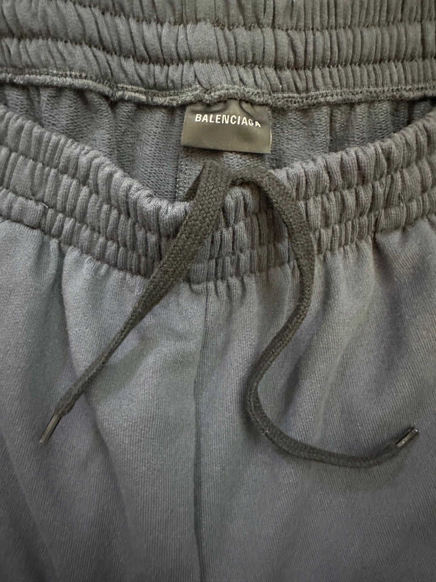 Balenciaga elastic waistband with drawstring and interior pocket opening on dark blue pants