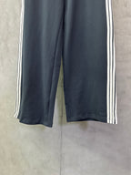 Balenciaga wide-leg track pants in dark blue with white side stripe trim