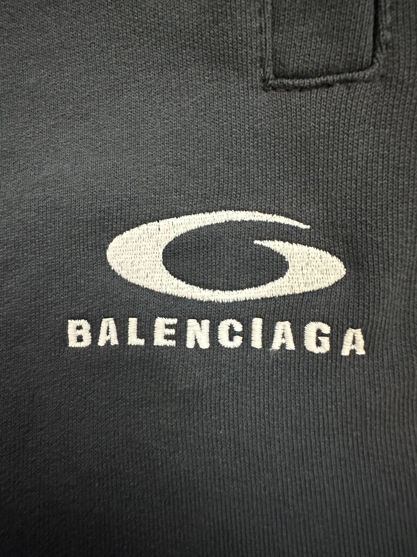 Balenciaga logo print on dark blue knit fabric pocket area