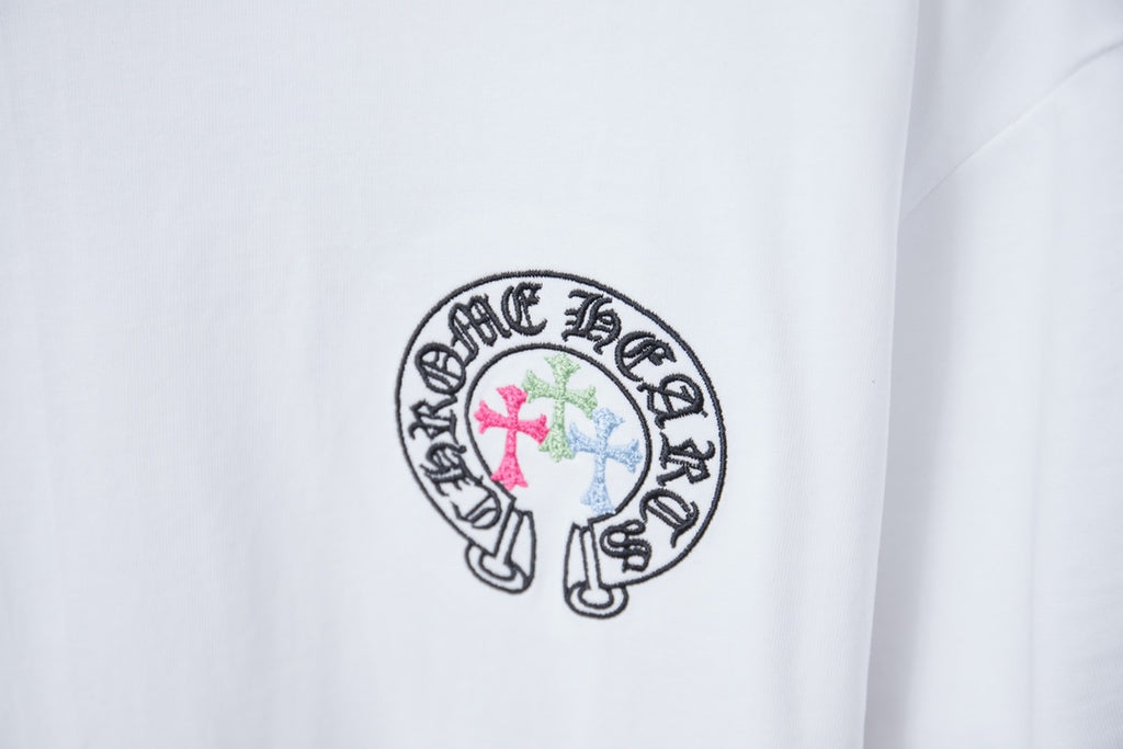 White T-shirt with small circular crest graphic logo