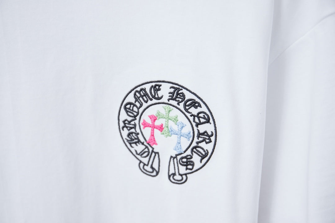 White T-shirt with small circular crest graphic logo