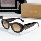 Bvlgari round sunglasses, black frames with tortoiseshell details and amber lenses