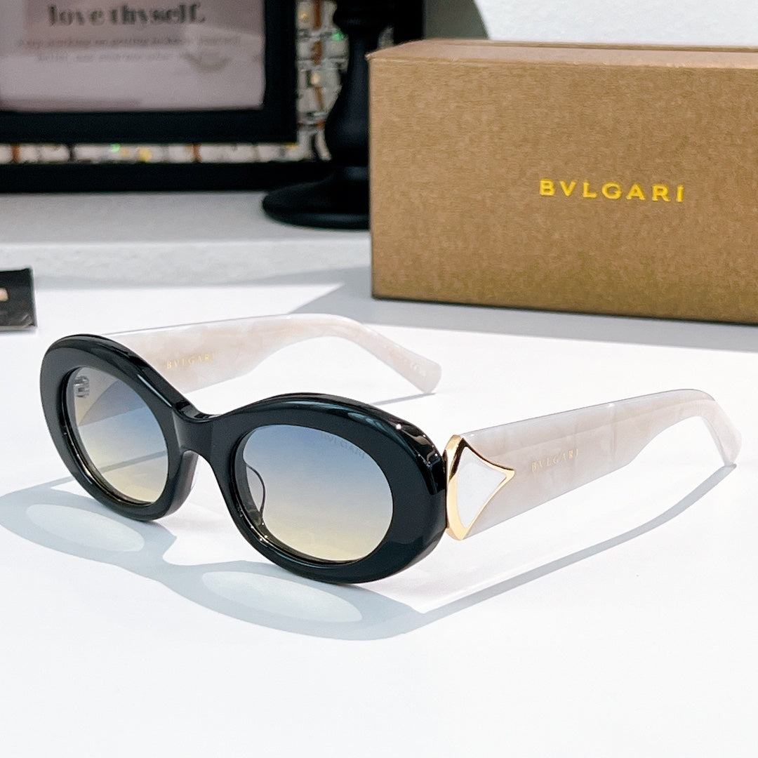 Bvlgari round sunglasses, dark blue frames with clear arms and gold logo accents