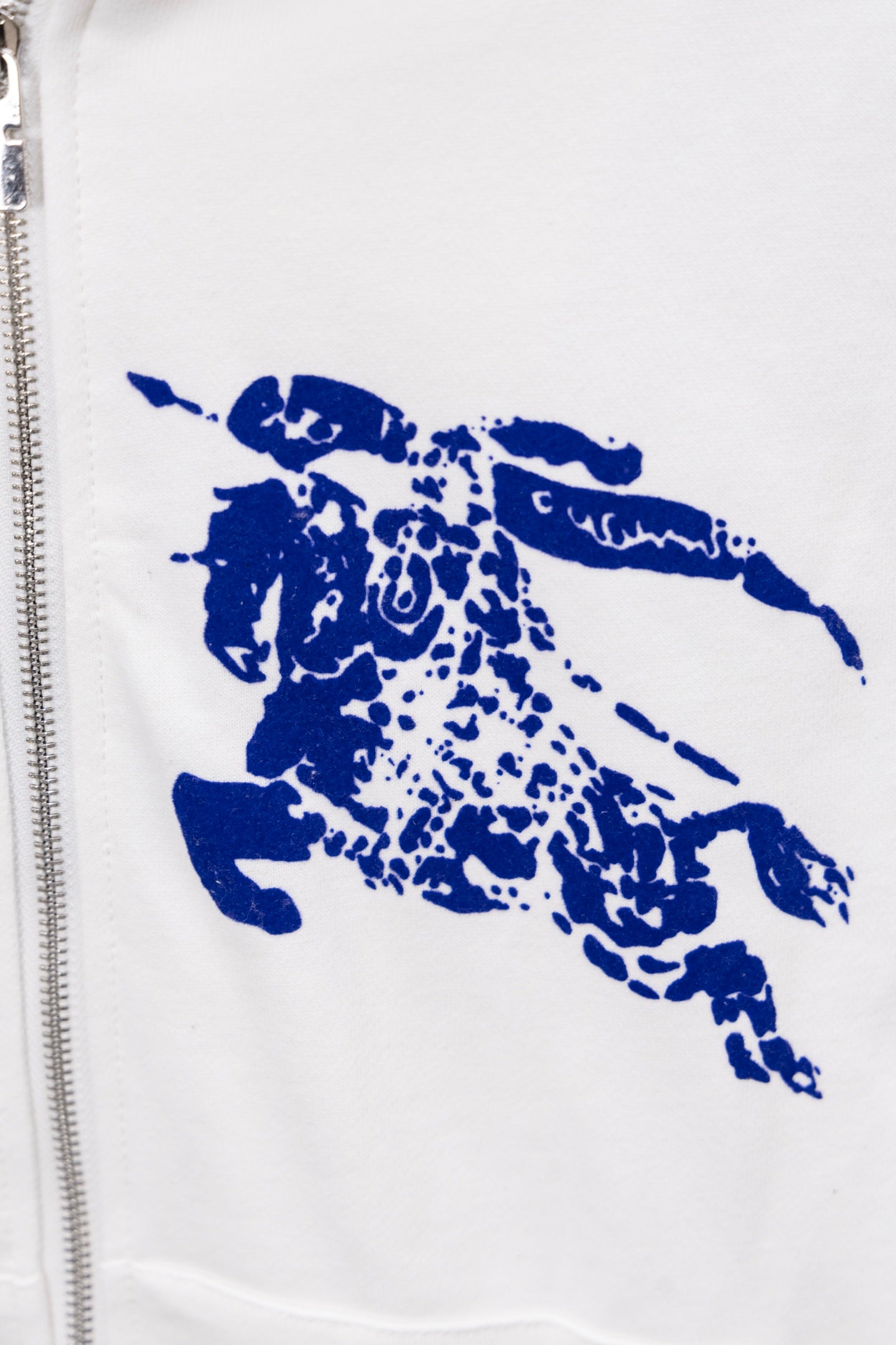 White hoodie front with large blue graphic print