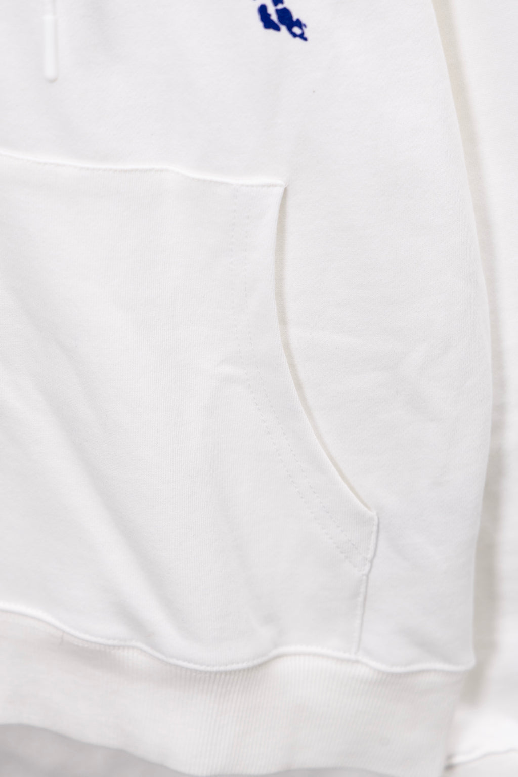 White hoodie hem with kangaroo pocket and drawstring ties