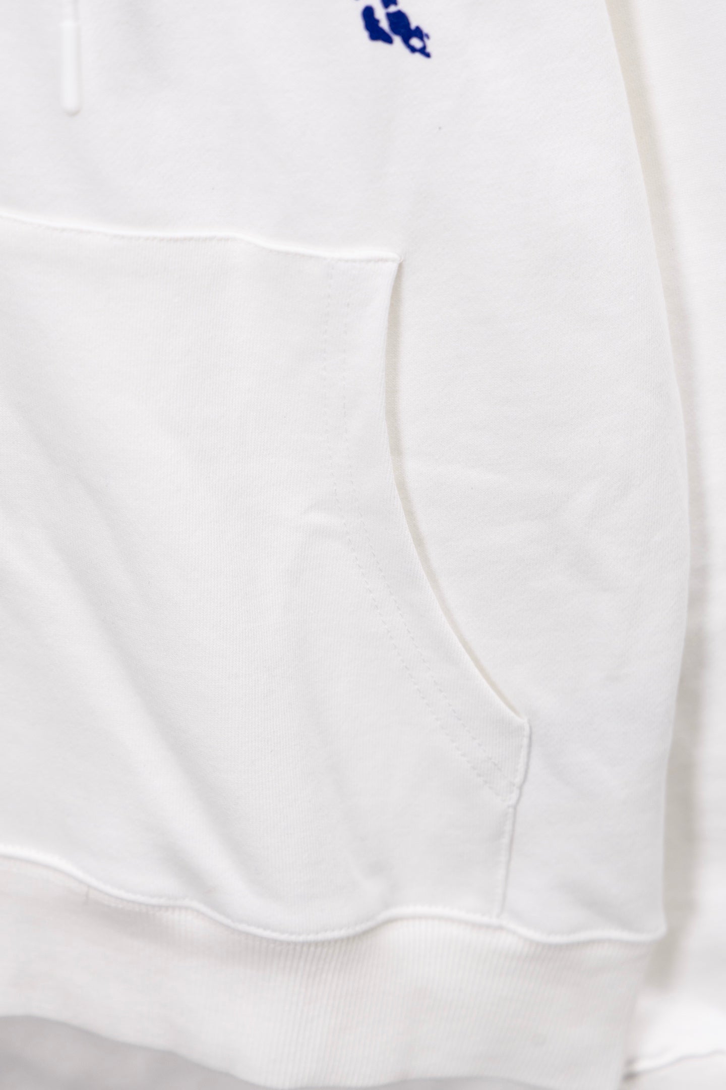 White hoodie hem with kangaroo pocket and drawstring ties