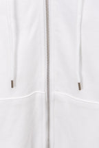 White hoodie front view showing full zip and drawstring-less pockets
