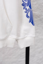 White hoodie cuff and pocket area with blue sleeve graphic print