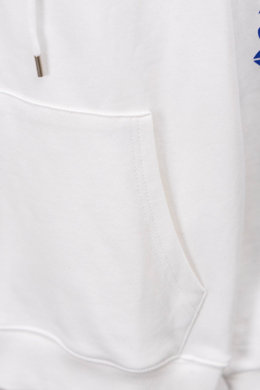 White long-sleeve sweatshirt cuff and hem seam