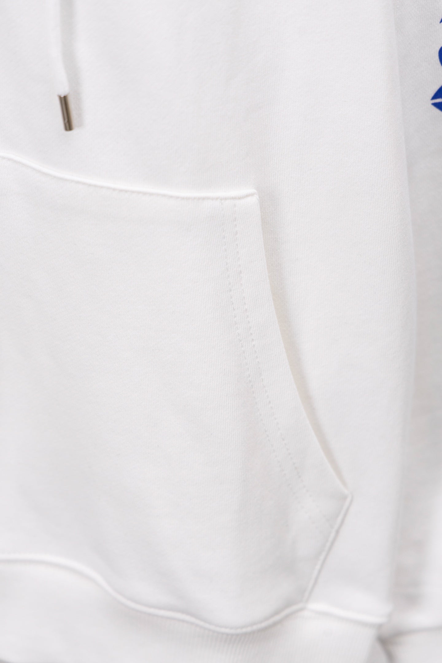 White long-sleeve sweatshirt cuff and hem seam