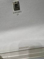 White pebbled leather bag back with Chanel label and "Made in Italy" text