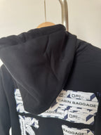Black hoodie hood and inner lining with Cabin Baggage graphic labels