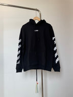 Dark pullover hoodie with drawstring hood and small chest logo
