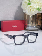 Eyeglasses with navy full-rim frames and rectangular lenses.