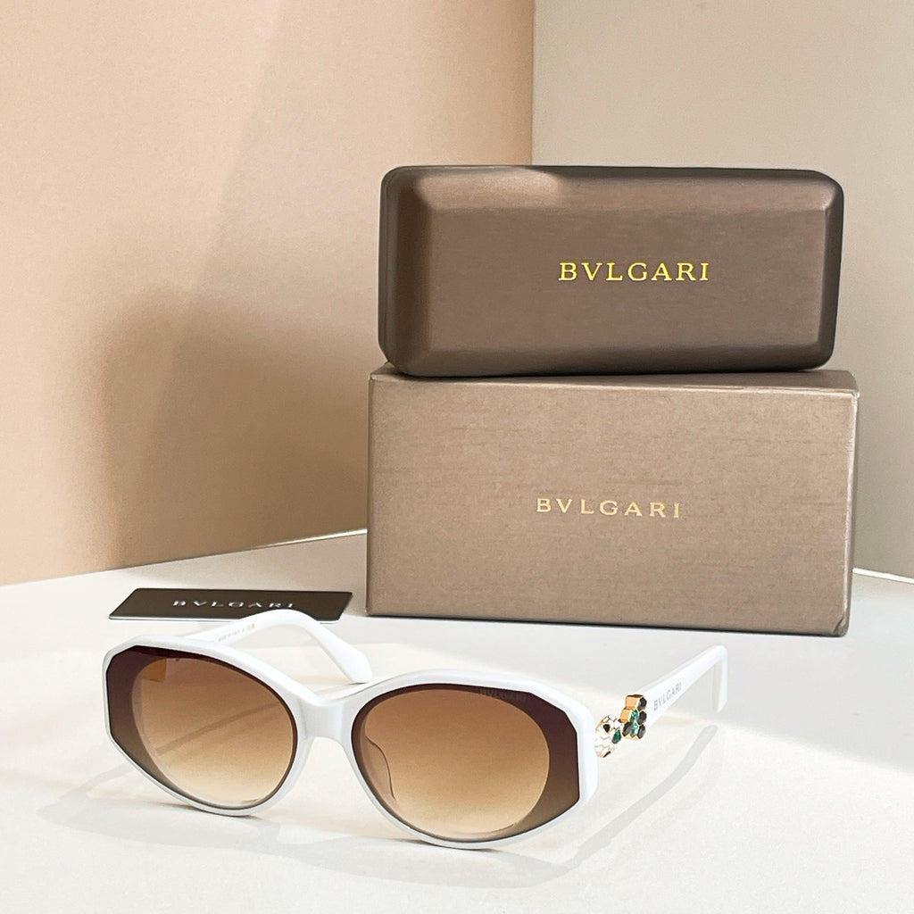 White sunglasses with tinted lenses and embellished temple detail