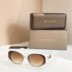 White sunglasses with tinted lenses and embellished temple detail