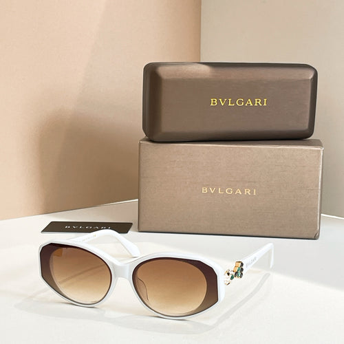 White sunglasses with tinted lenses and embellished temple detail