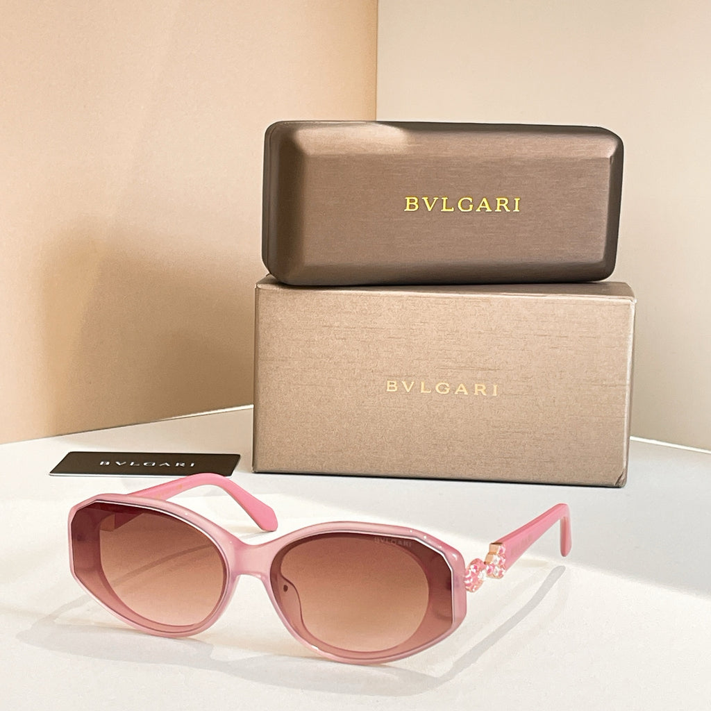 Pink sunglasses with tinted lenses and embellished temple detail