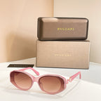 Pink sunglasses with tinted lenses and embellished temple detail