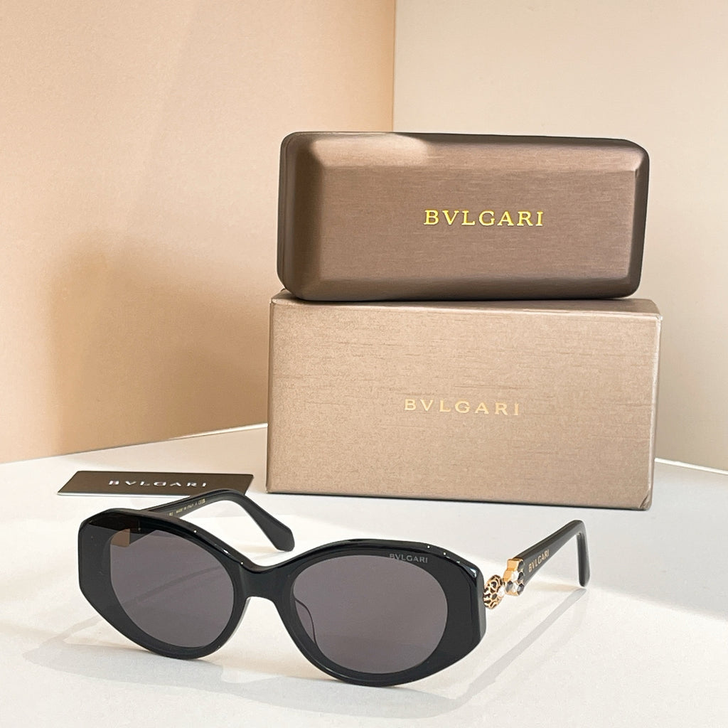 Black sunglasses with tinted lenses and embellished temple detail
