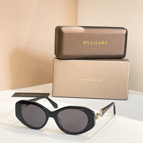 Black sunglasses with tinted lenses and embellished temple detail