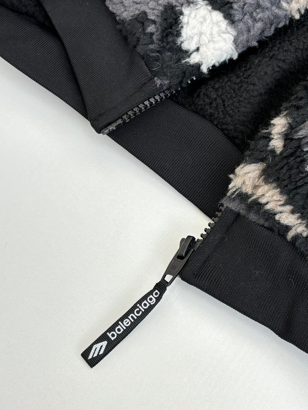 Balenciaga fleece jacket zipper and pull tab, black with white logo text