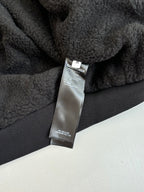Balenciaga fleece jacket care label on dark interior panel