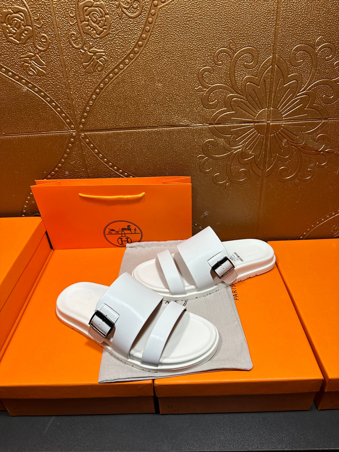 Hermes white slide sandals with two straps and silver buckle hardware