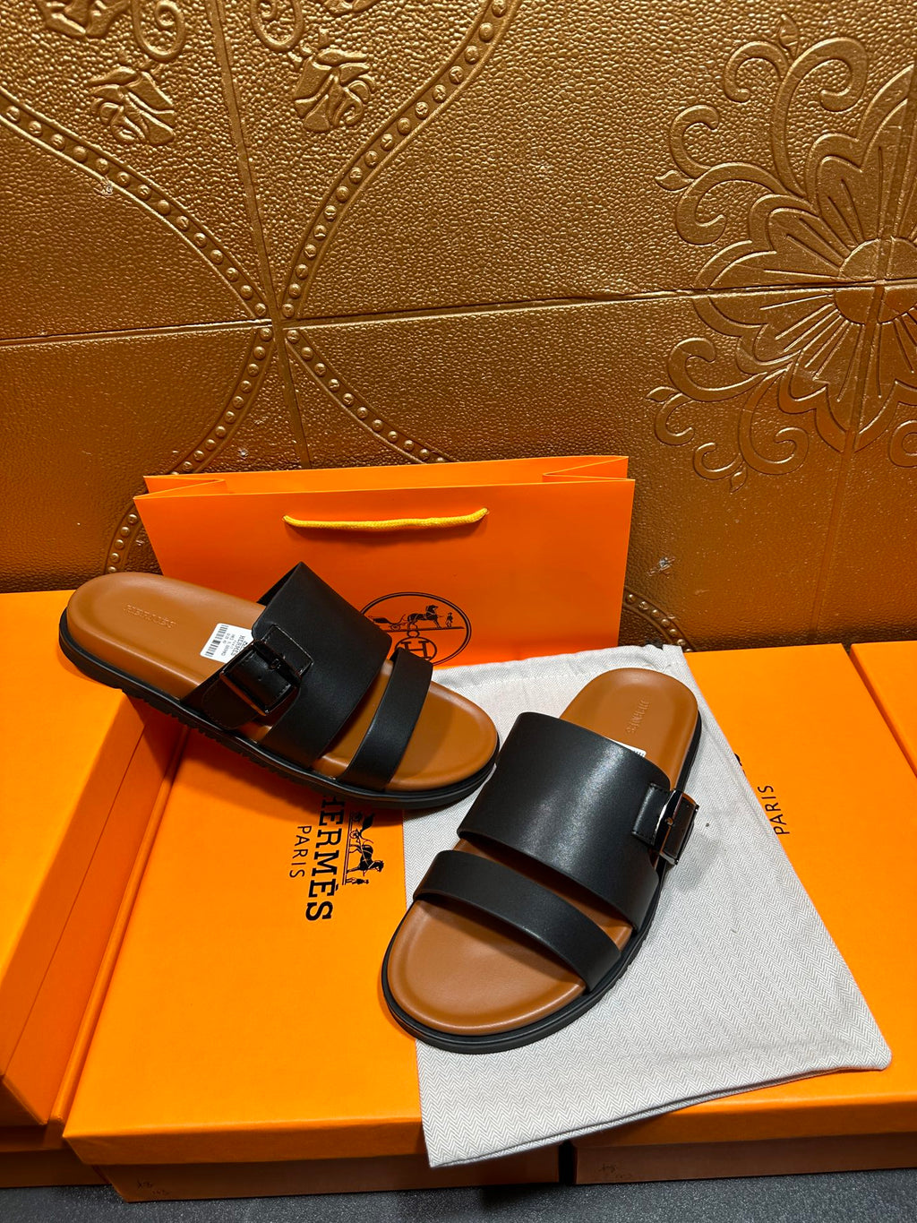 Hermes leather slide sandals, pair view with black straps and buckle, open toe