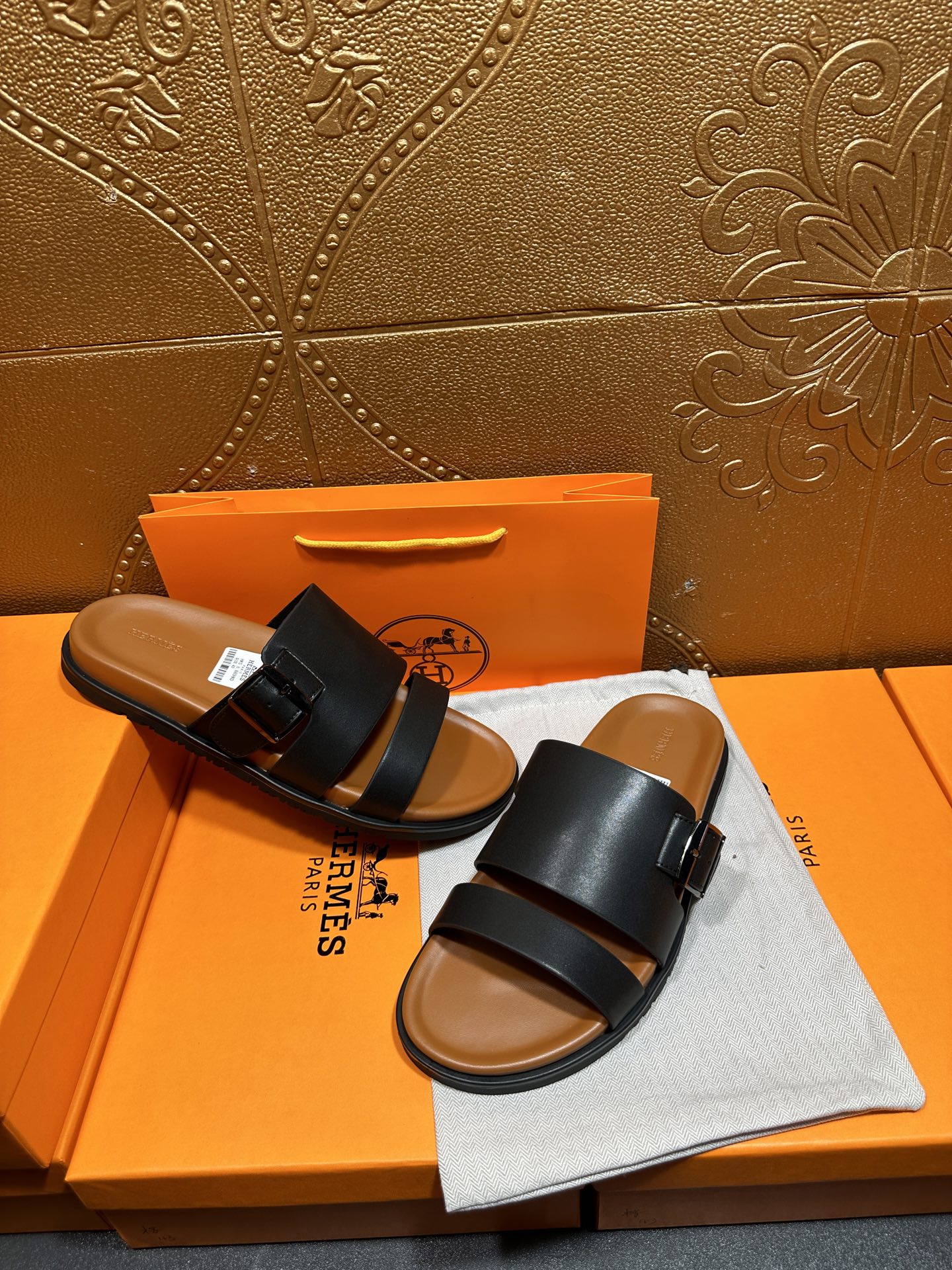 Hermes leather slide sandals, pair view with black straps and buckle, open toe