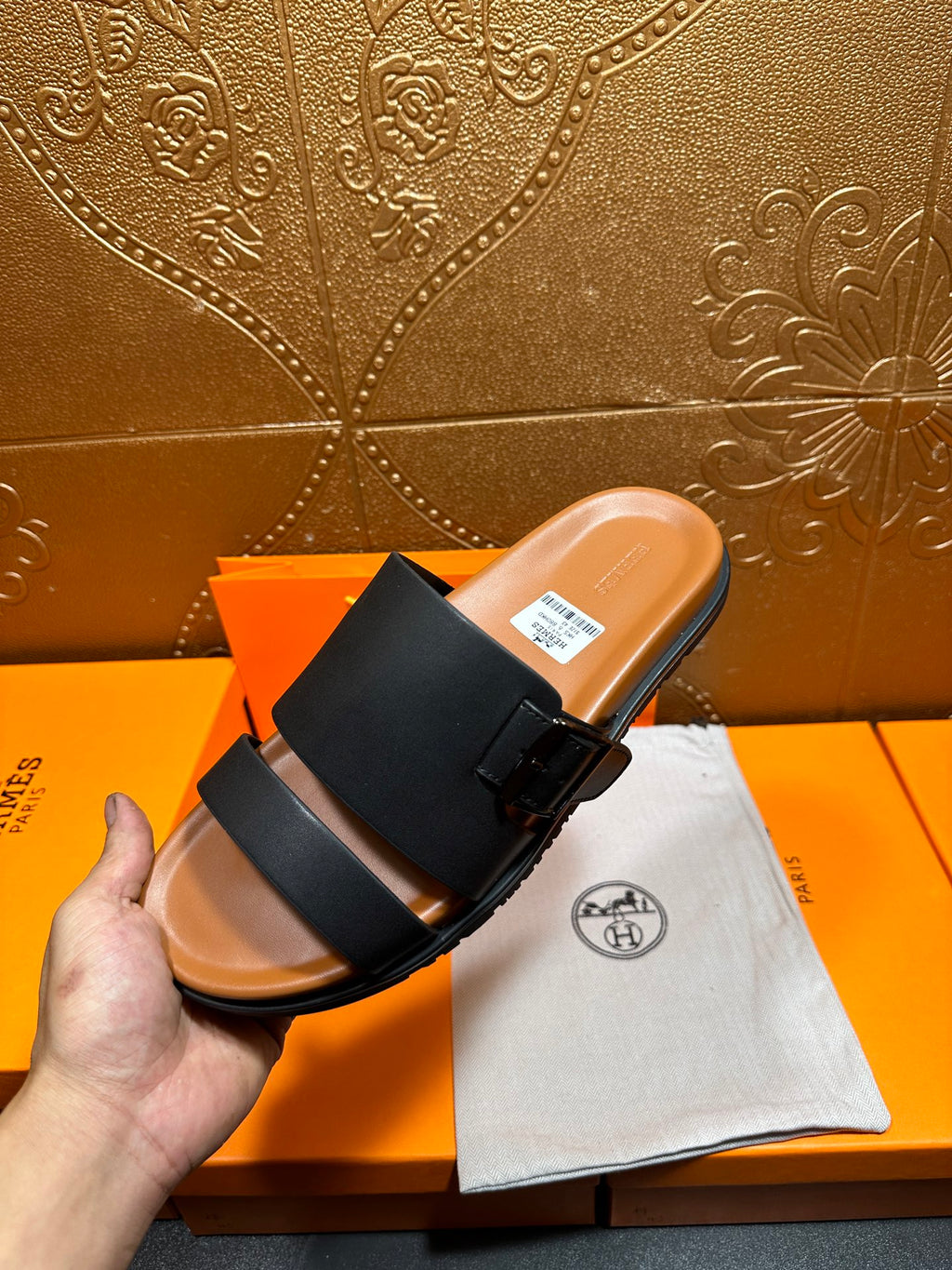 Hermes leather slide sandals, black strap sandal held up with tan footbed