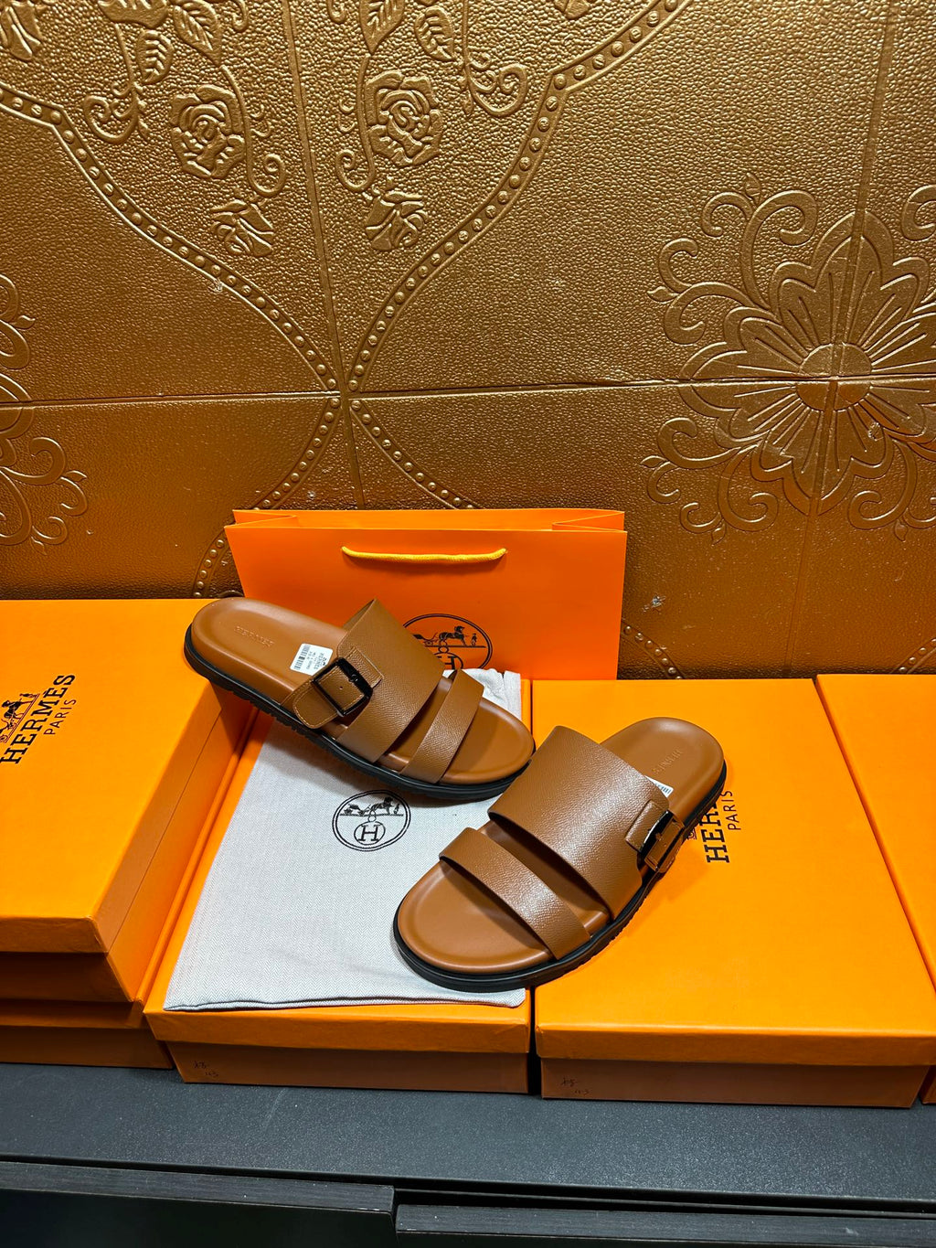 Hermes tan-brown leather sandals with two wide straps and adjustable metal buckle
