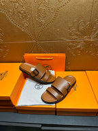 Hermes tan-brown leather sandals with two wide straps and adjustable metal buckle