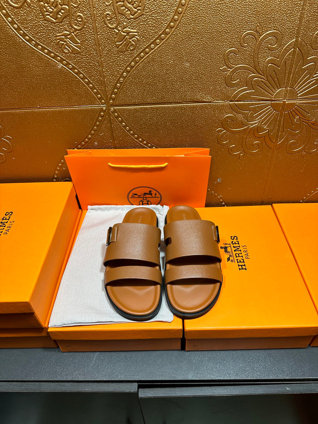 Hermes tan-brown leather sandals with two wide straps and adjustable buckle
