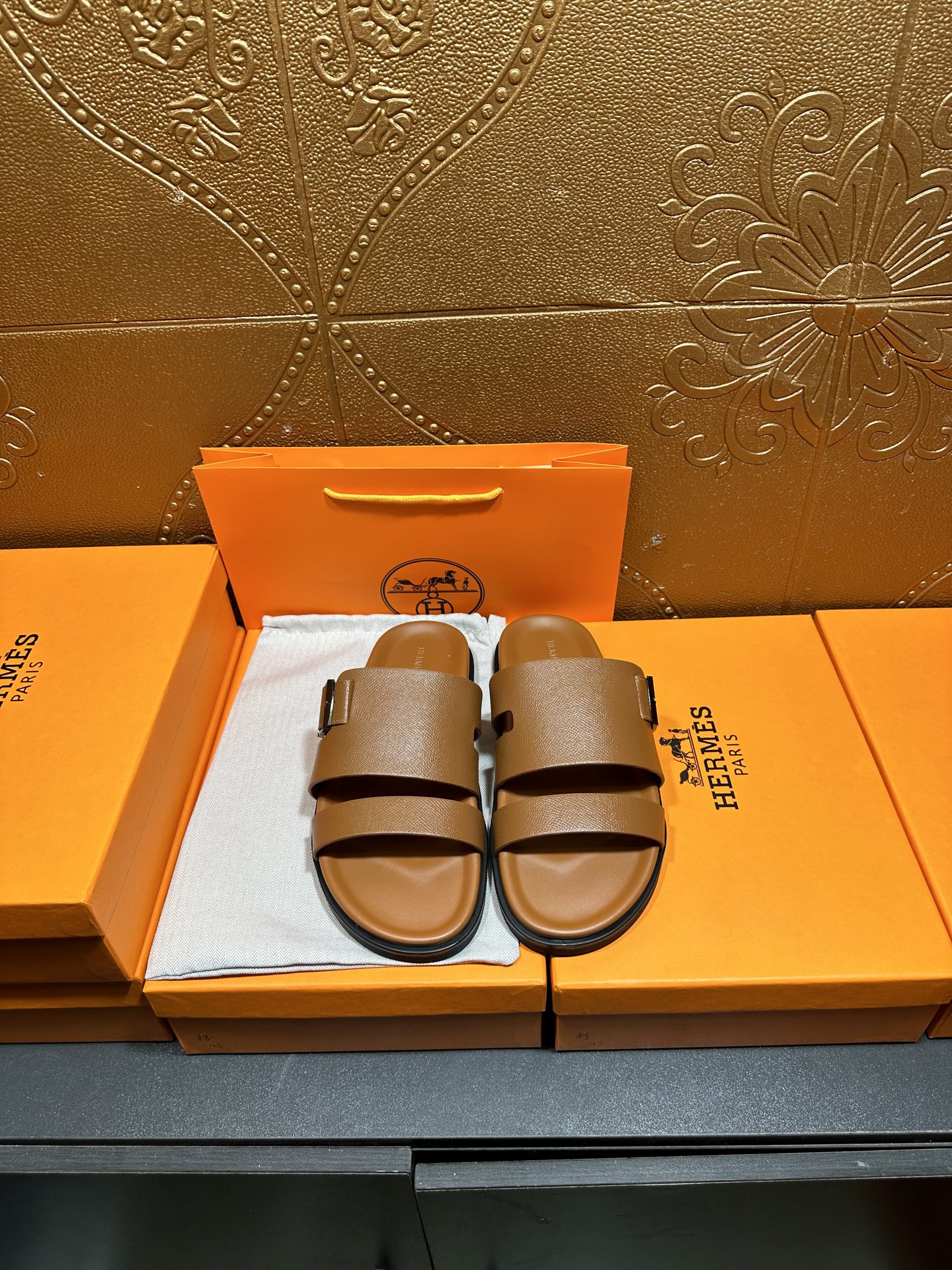 Hermes tan-brown leather sandals with two wide straps and adjustable buckle