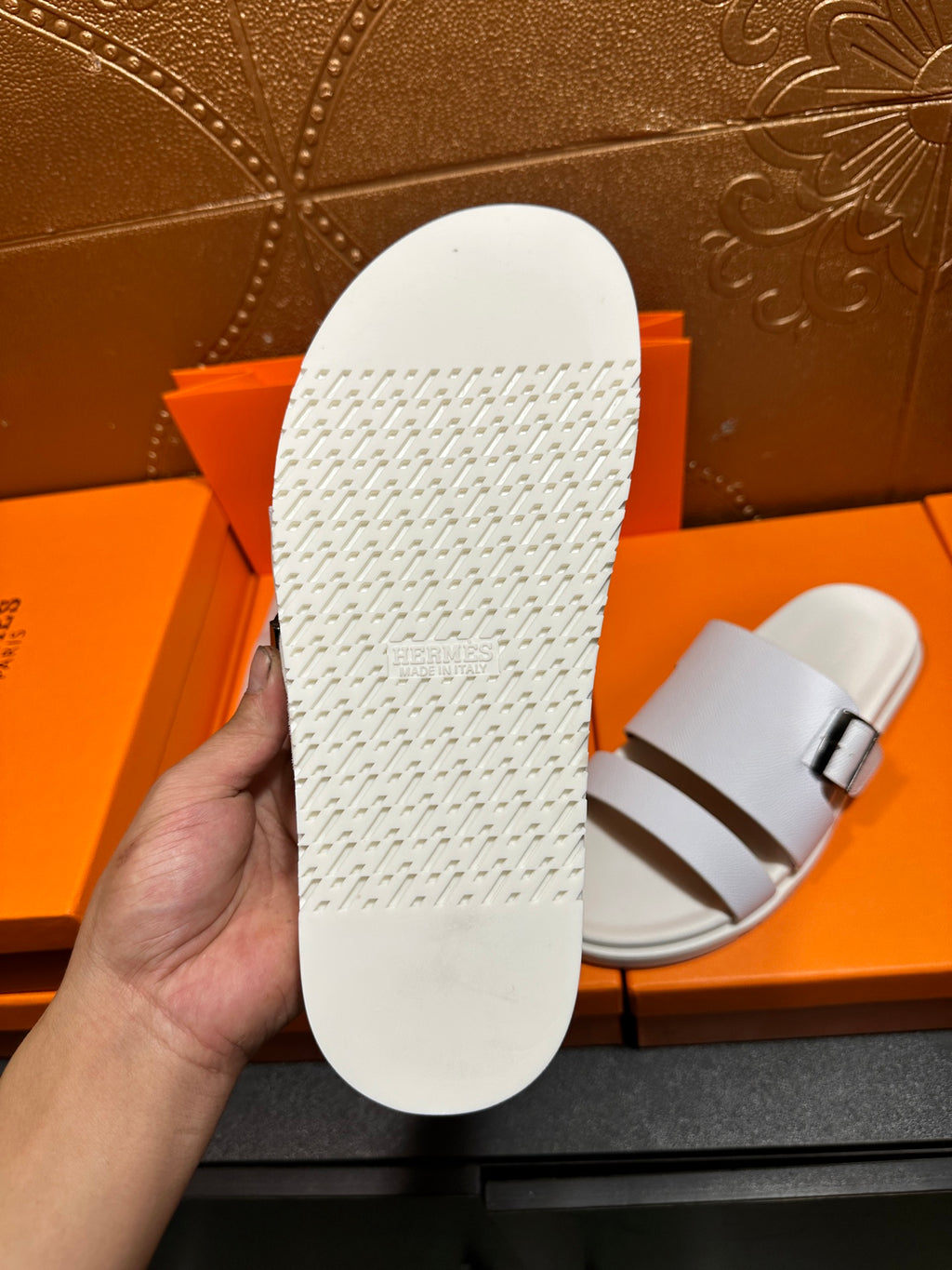 Hermes white sandal outsole with textured tread pattern, sole side view