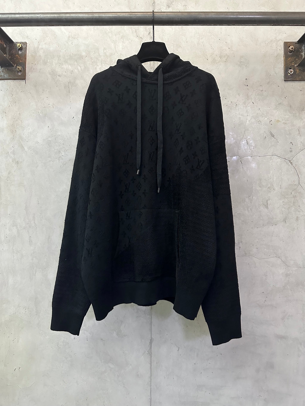 Louis Vuitton monogram hoodie in dark color with drawstring hood and front pocket