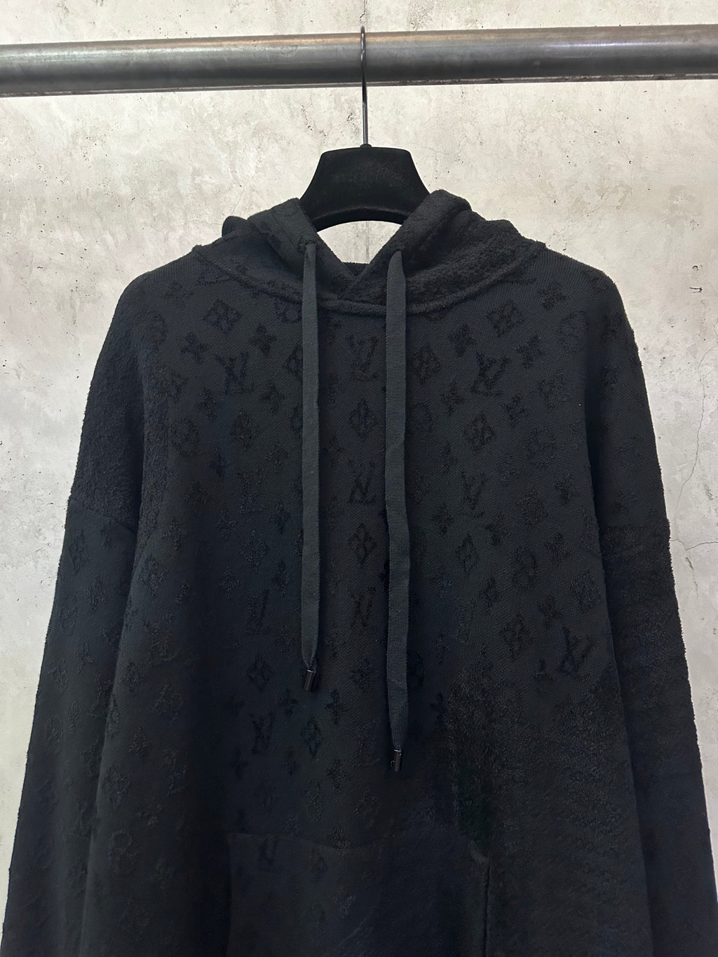 Louis Vuitton monogram hoodie front view with drawstring hood and zipperless placket