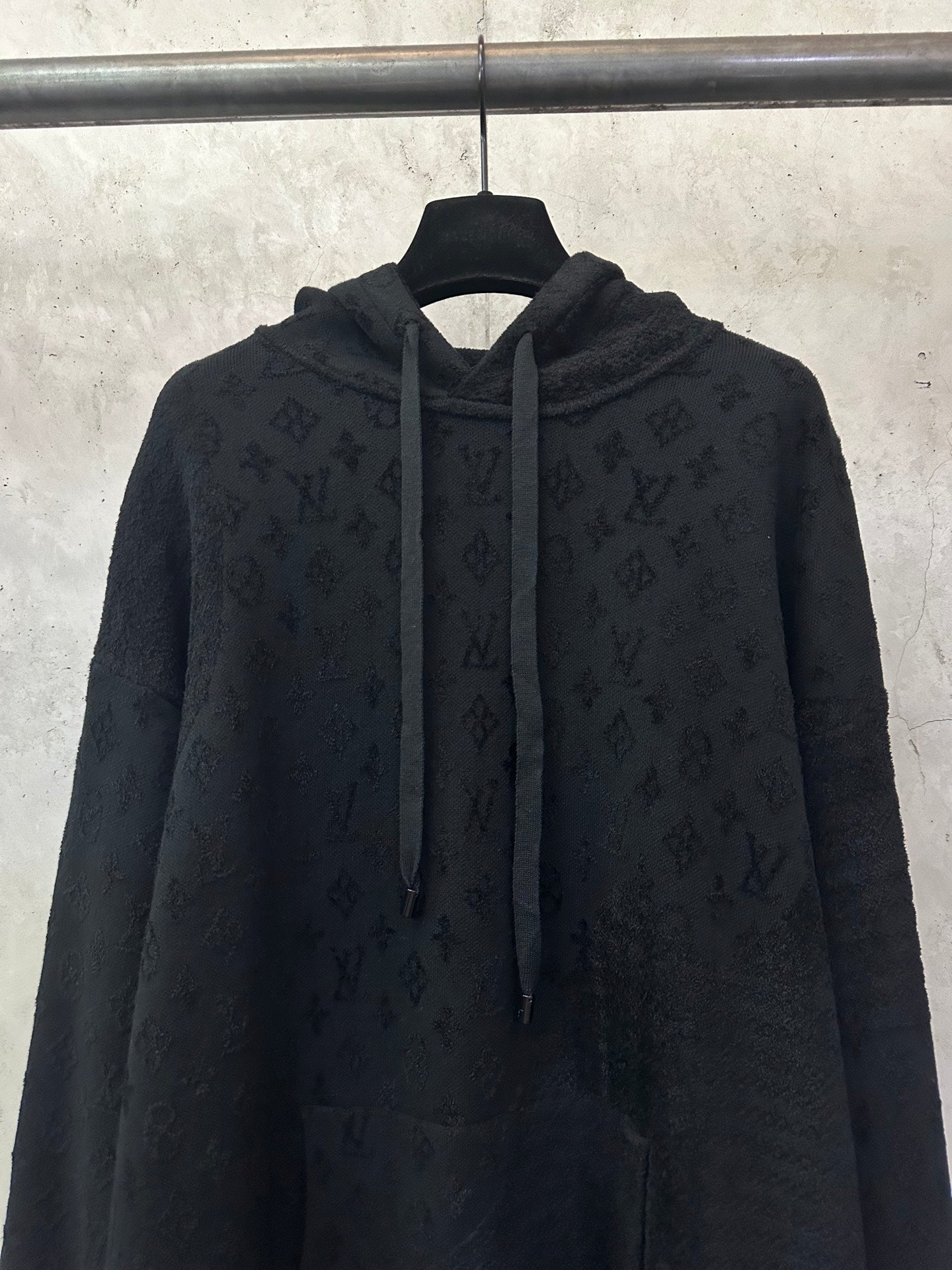 Louis Vuitton monogram hoodie front view with drawstring hood and zipperless placket