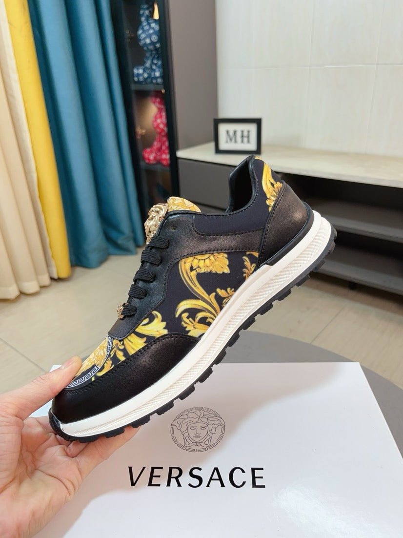 Versace lace-up sneakers, black leather with gold emblem and yellow pattern, white midsole