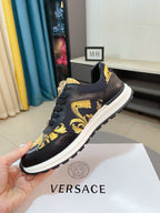 Versace lace-up sneakers, black leather with gold emblem and yellow pattern, white midsole