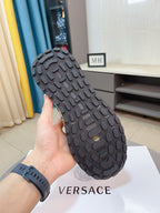 Versace sneaker outsole, dark rubber tread with grip pattern