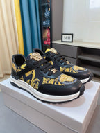 Versace lace-up sneakers, black with gold and yellow baroque print, chunky white midsole