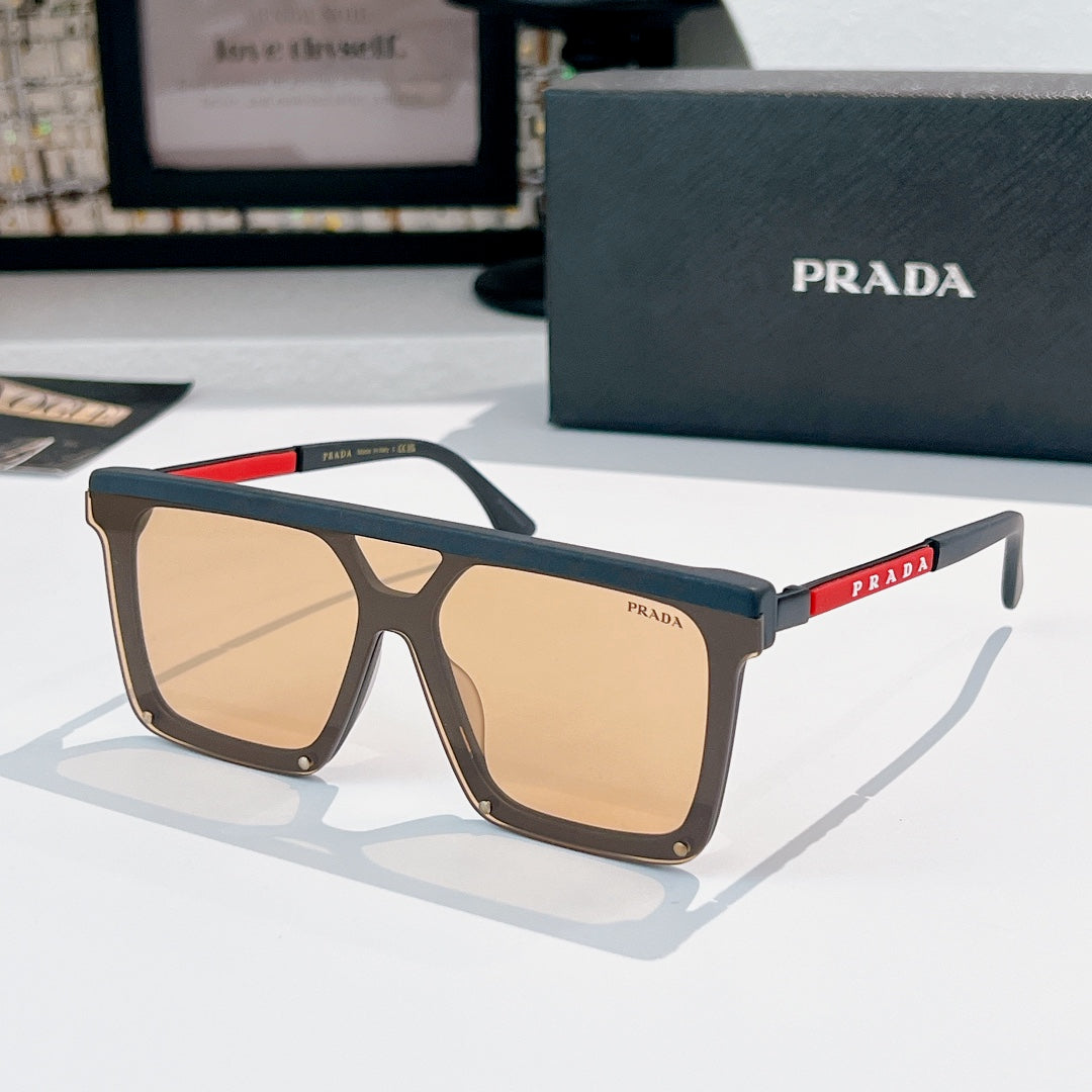 Prada sunglasses with dark frame and tan tinted lenses