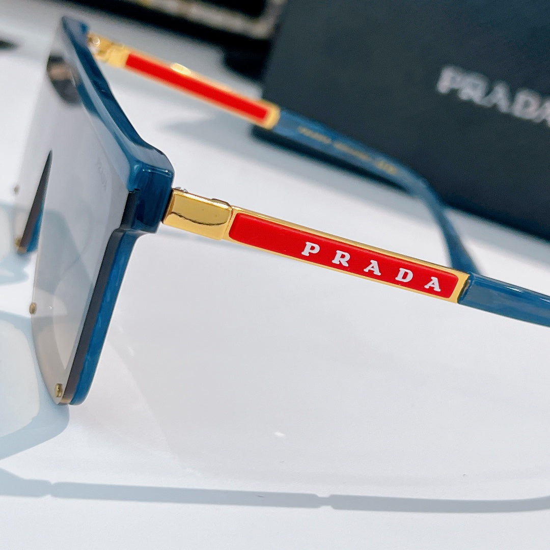 Prada sunglasses side view with blue frame and red PRADA logo detail