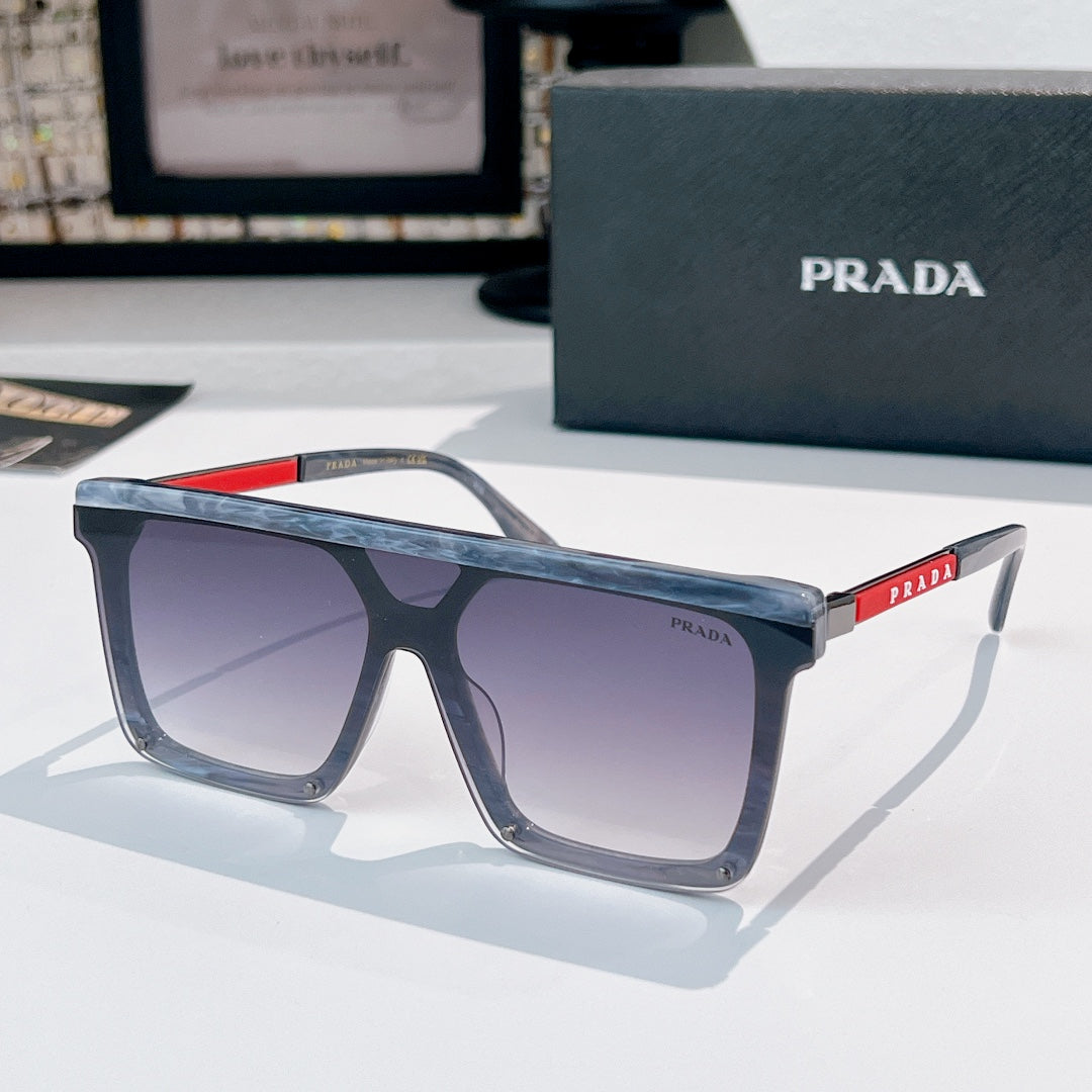 Prada sunglasses with blue-gray translucent frame and purple tinted lenses