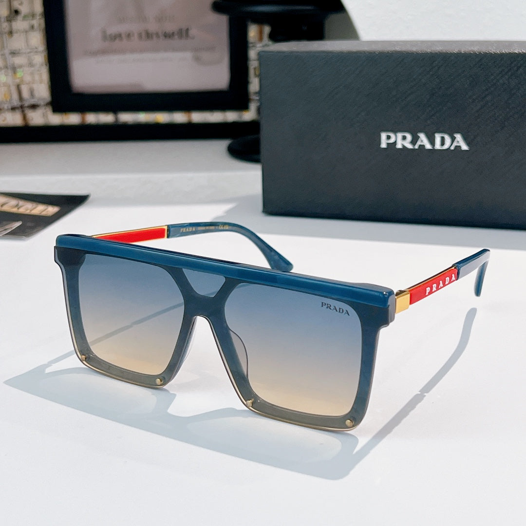 Prada sunglasses with blue frame and gradient tinted lenses