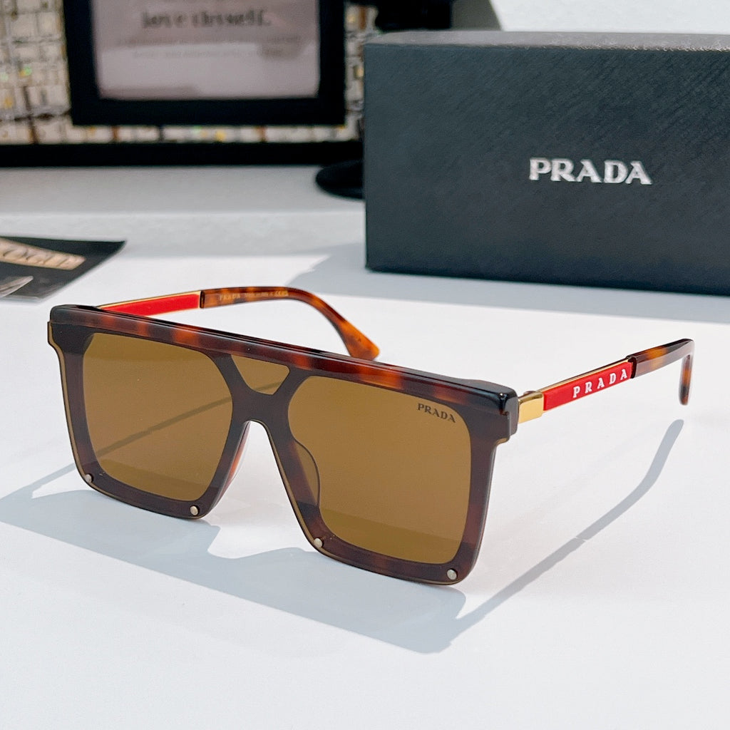 Prada sunglasses with tortoise frame and amber tinted lenses